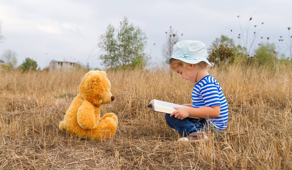 Image of Little girl reading book