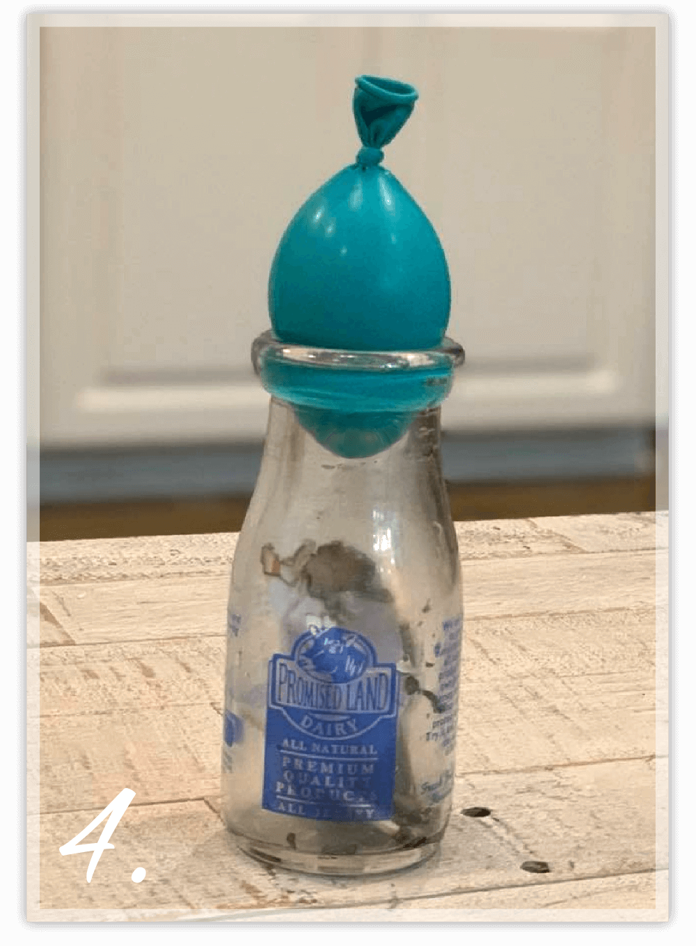 Balloon sucked into glass bottle