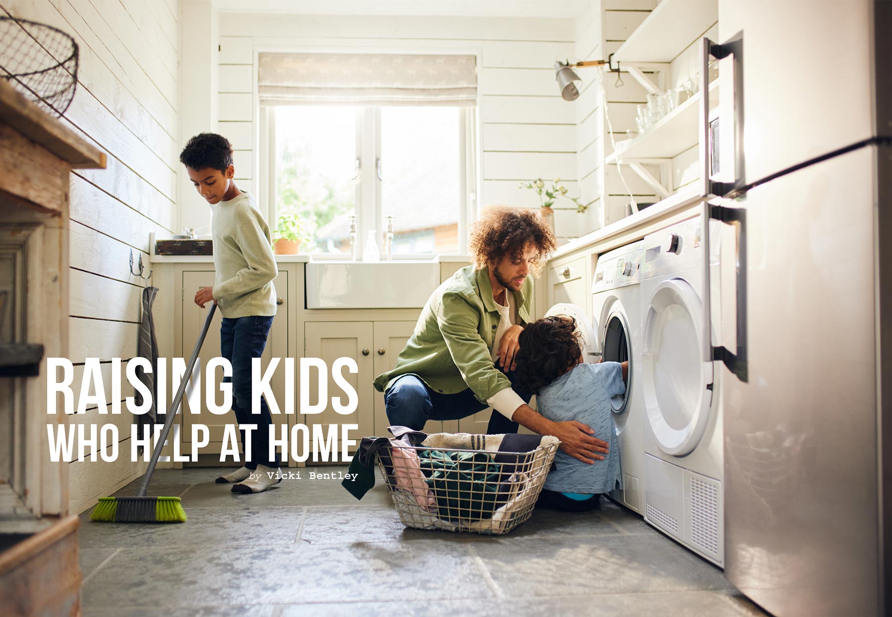 a father helping his kid with laundry while his other kid sweeps next to them
