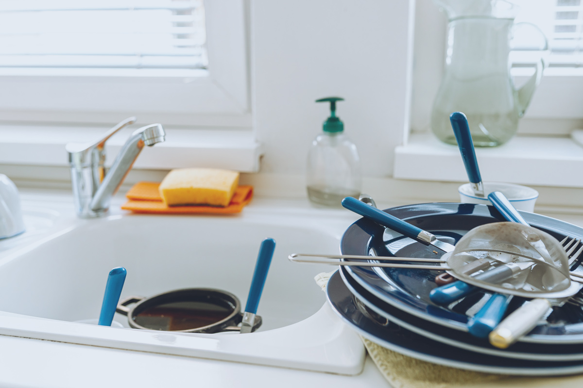 unwashed dishes on sink