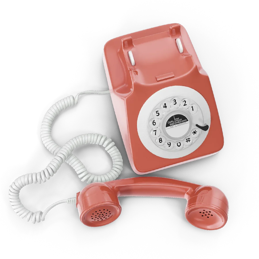 Old school fashion vintage style helpline phone with cord and twisted dial in coral color
